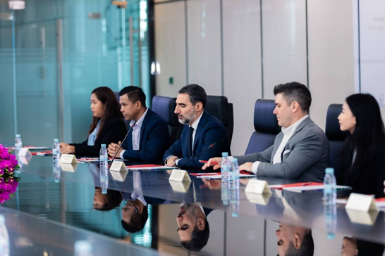 Cibes Lift Cambodia team in a business meeting discussing accessibility and modern lift solutions in Cambodia