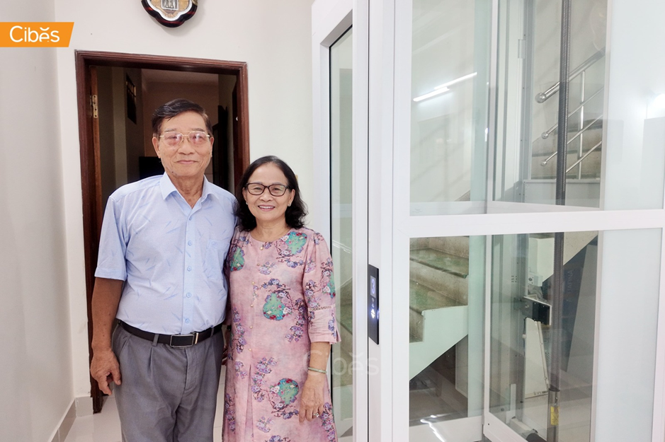 Glass home elevator in a private house, helping an older couple move safely between floors